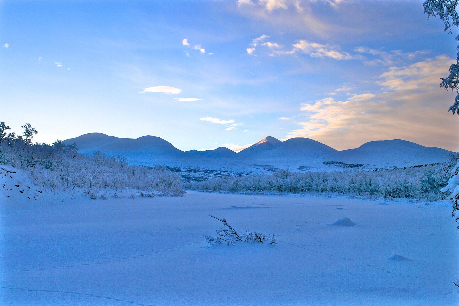 Snow-covered mountains and a frozen valley near Abisko in Swedish Lapland